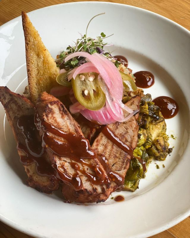 We have a dinner special running all weekend that is mighty tasty! Chipotle BBQ pork loin with loaded crispy smash potatoes, chimichurri brussels sprouts, cornbread baguette, pickled jalapeños & red onion, and topped with micro cilantro. Come give this dish a try tonight! 🔥