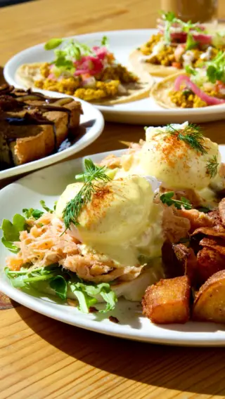 Make sure your weekend plans include Sunday Brunch here at The Millworks. The Eggs Benedict with Smoked Salmon and Arugula is a classic choice. Made with an
english muffin, poached farm eggs, homemade hollandaise, crispy fried potatoes, smoked salmon and arugula.